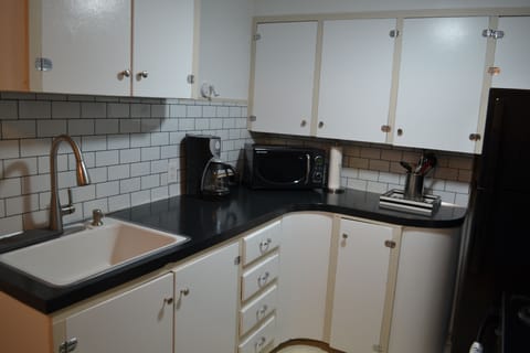 Full sized private kitchen; coffee supplies and kitchen necessities included.