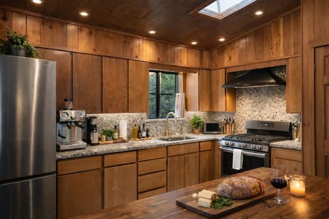 Warm, wood-accented kitchen with modern stainless appliances