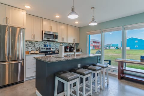 Bright coastal kitchen and breakfast bar