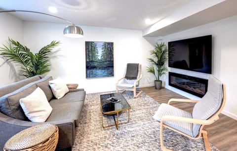 Living area with fireplace and Smart TV for streaming your favourite shows.