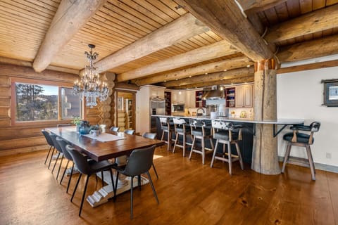 Large dining room table with plenty of room for the whole family to enjoy meals or family game night.