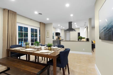 Custom made solid wood dining table with comfortable chairs. Seats 8 guests.