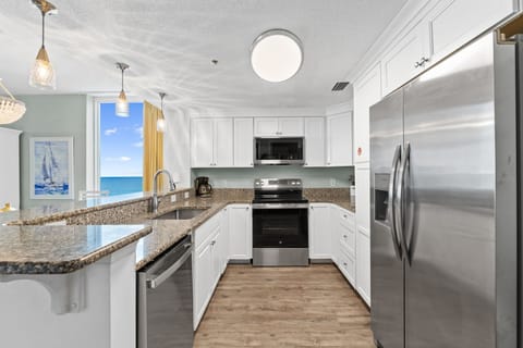 The full‑sized kitchen is equipped with modern appliances and everything you need for easy vacation cooking.