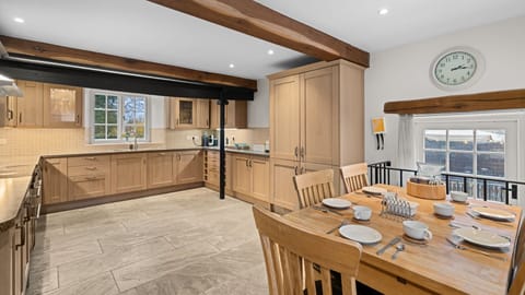 Ancient beams add interest and there is a breakfast table that seats five.