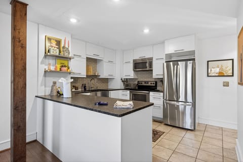 Bright, modern kitchen with stainless steel appliances, ample counter space, and everything you need to cook and gather with ease.