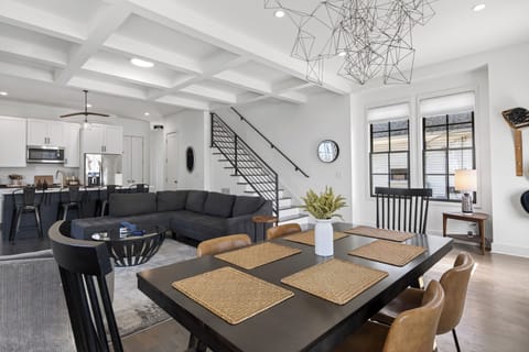 Perspective from the dining table looking toward the living area and stairs.
