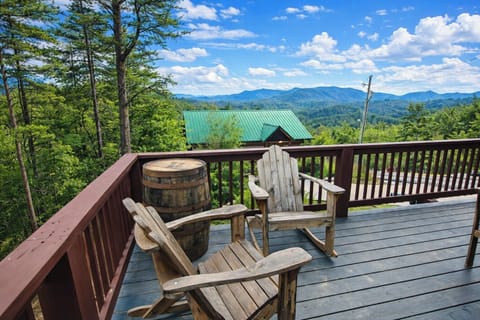 Relax on the deck with Adirondack chairs and sweeping Smoky Mountain views.