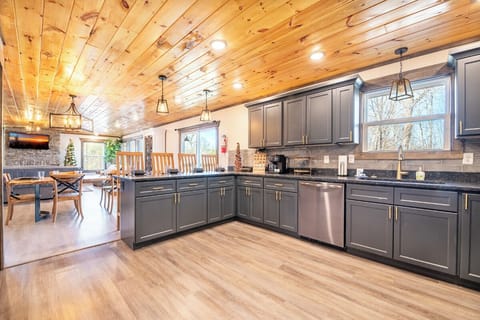 Your spacious kitchen invites culinary adventures with granite counters, stainless appliances, and warm wood accents creating the perfect gathering space.