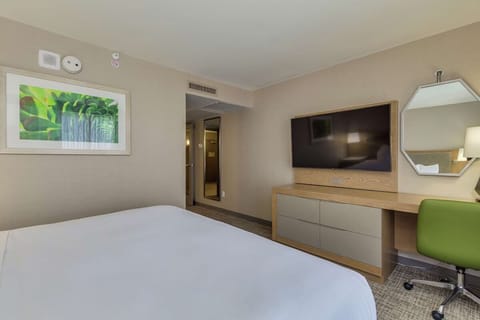 Recharge after a long day with a calm, modern room.