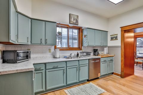 Bright, fully equipped kitchen with charming vintage details, updated appliances, and plenty of counter space.