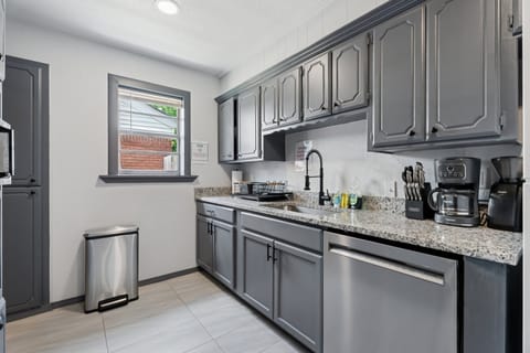 Bright and spacious with stainless steel accents and essential tools—perfect for coffee, breakfast, or full meals.