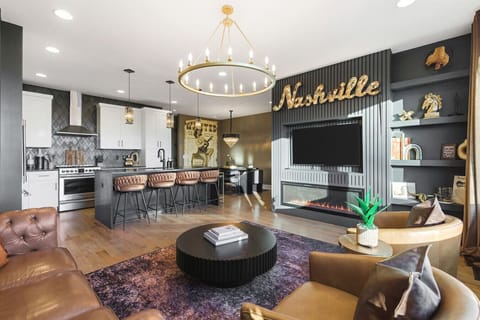 Spacious, stylish living room with a smart TV, sofa, fireplace and comfortable new furnishings for you to relax. Curl up and enjoy the fireplace while looking out at an incredible view of the city!