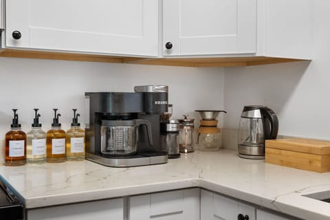Deluxe coffee bar with a Keurig, drip coffee, pour over, French press, and tea kettle.