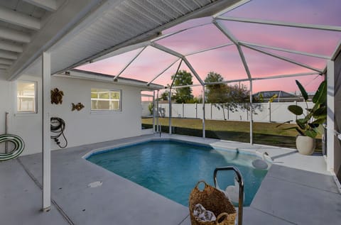 Your private screened pool oasis — sunshine, swims, and total relaxation from morning to sunset.