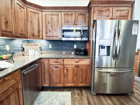 Stainless steel appliances and large counter space make cooking enjoyable.