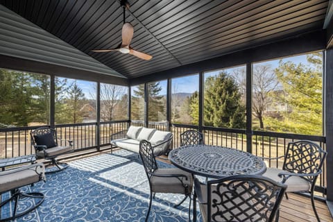 Large screened-in porch for relaxing and outdoor dining