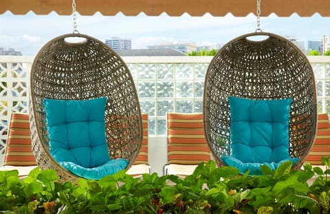 Lounge in hanging chairs and feel the breeze outside.
