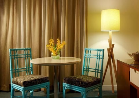 Sip morning coffee at the bistro table by soft light.