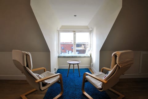 The bedroom has a seating area with wonderful views