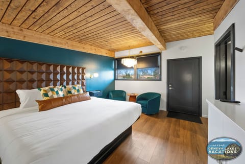 Enjoy this spacious room with king bed,  smart TV and comfortable seating area.