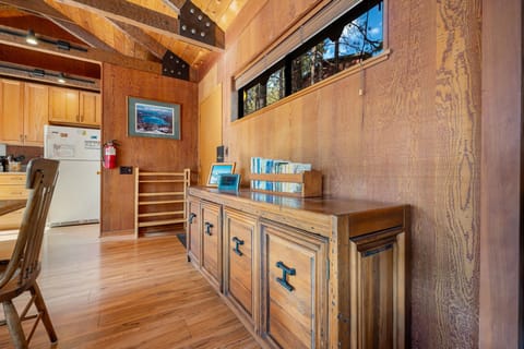Hutch next to the dining table with books and games