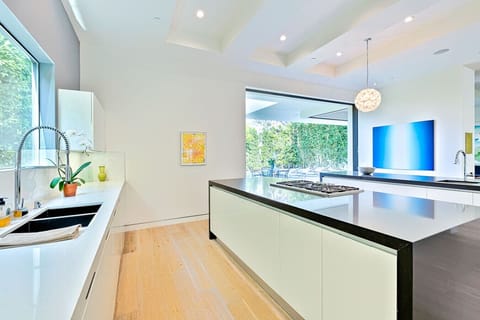 Sleek, modern kitchen with spacious countertops, fully equipped for daily cooking or entertaining