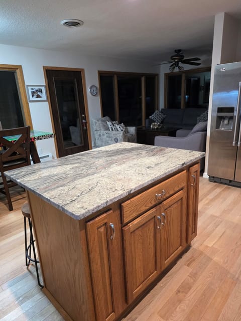 Seating for 3 at island.