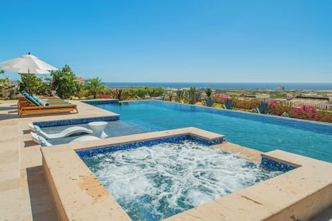 Soak in your private hot tub while gazing at endless ocean views, then cool off in the infinity pool.