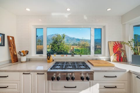 Cook your favorite meals while enjoying stunning mountain vistas through this beautiful kitchen window, where culinary creativity meets natural beauty.