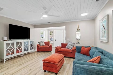 Living area with comfy seating and large smart TV