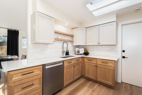 Fully equipped kitchen with modern finishes and ample prep space.