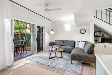 Unwind in the light-filled living area, where a box air conditioner keeps things cool, and a smart TV with Netflix sets the tone for easy evenings in.