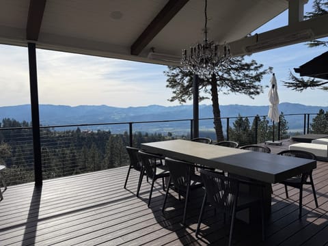 Outdoor oversized concrete dining table with seating for 8