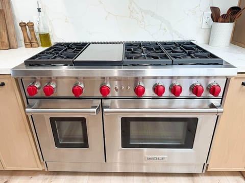 Professional Chefs Wolf Gas  Range with a griddle.