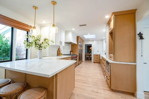 Guests can pull up a seat while preparing meals. Plenty of counter space makes it comfortable for multiple cooks at once.
