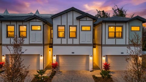 Arrive at your modern, Tudor-inspired townhome at Paradiso Grande-sunset glow, crisp lines, and a two-car garage welcome you to a stylish stay.
