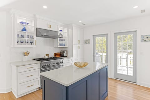 CENTER ISLAND, TOP OF LINE APPLIANCES, CONVENIENT DECK FOR GRILL AND RELAX TIME.