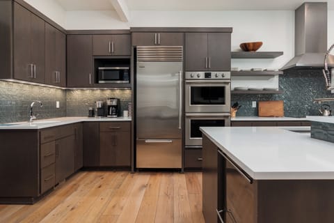 Your fully equipped gourmet kitchen features stainless steel appliances, quartz countertops, and everything you need to create memorable meals during your stay.