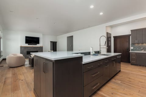 Your spacious kitchen island becomes the heart of your stay, with sleek countertops and modern appliances ready for culinary adventures.