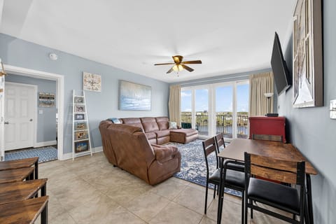 spacious living room with waterfront views and modern seating