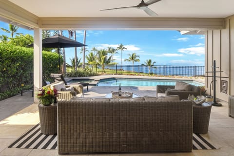 Unwind in your private tropical paradise with oceanfront pool and lounging area perfect for soaking up island vibes.