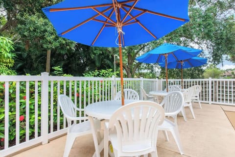 Unwind on the spacious deck with poolside seating nearby.