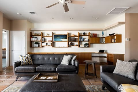 Kick back on the leather sofa or catch up on emails at the built-in workstation.