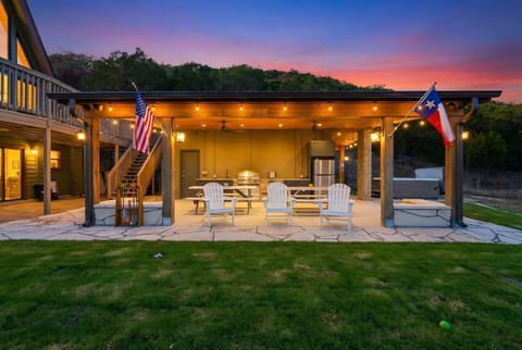 Covered outdoor patio with seating and string lights—perfect for evenings and gatherings.