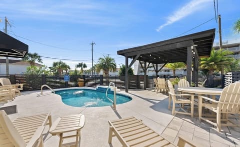 Private heated pool with outdoor seating