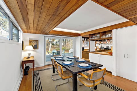 Orleans retreat, two homes joined by decks, wooded privacy