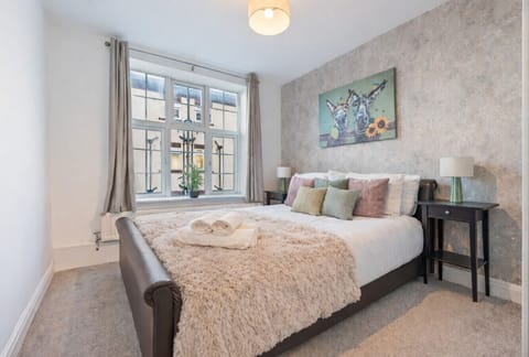 Bedroom 1 features a comfortable double bed with fresh linen and towels provided