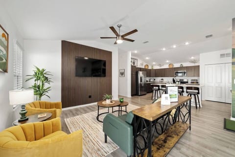 Open living room with a beautiful acoustic tile accent wall to compliment the space.