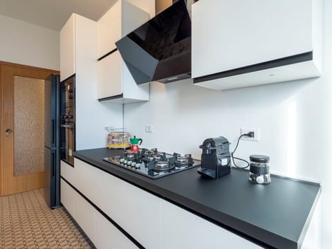 Kitchen, Kitchen Appliance, Kitchen Stove, Major Appliance, Countertop, Interior Design, Gas Stove, Stove, Flooring, Cabinetry