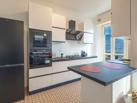 Kitchen Appliance, Kitchen, Interior Design, Countertop, Furniture, Major Appliance, Flooring, Cabinetry, Kitchen Stove, Home Appliance